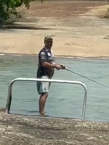 The man continued to fish in the river after locals tried to warn him about the dangers lurking beneath the water. Picture: wildmanadventures/ Instagram