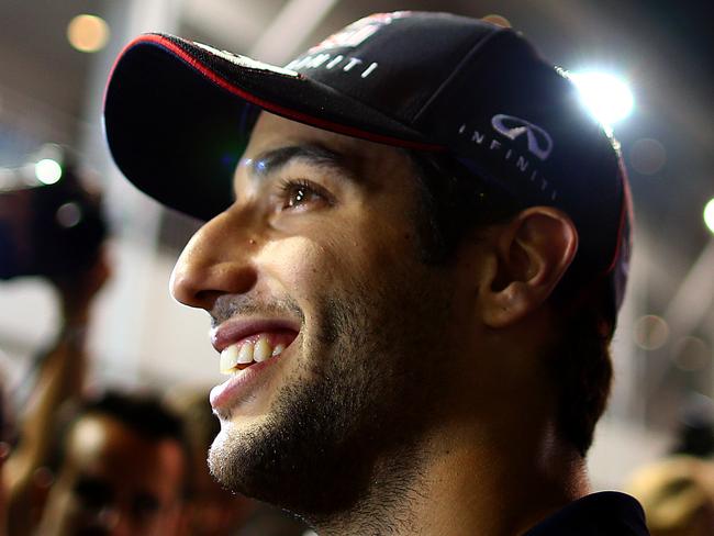 SINGAPORE - SEPTEMBER 18: Daniel Ricciardo of Australia and Infiniti Red Bull Racing smiles as he speaks with members of the media during previews ahead of the Singapore Formula One Grand Prix at Marina Bay Street Circuit on September 18, 2014 in Singapore, Singapore. (Photo by Clive Mason/Getty Images)