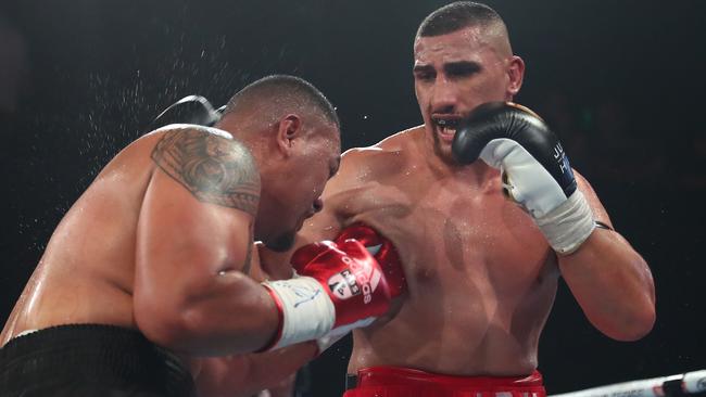 BRISBANE, AUSTRALIA - OCTOBER 22: Justis Huni punches Faiga Opelu during their Australia Heavy Weight Title bout at The Fortitude Music Hall on October 22, 2020 in Brisbane, Australia. (Photo by Chris Hyde/Getty Images)