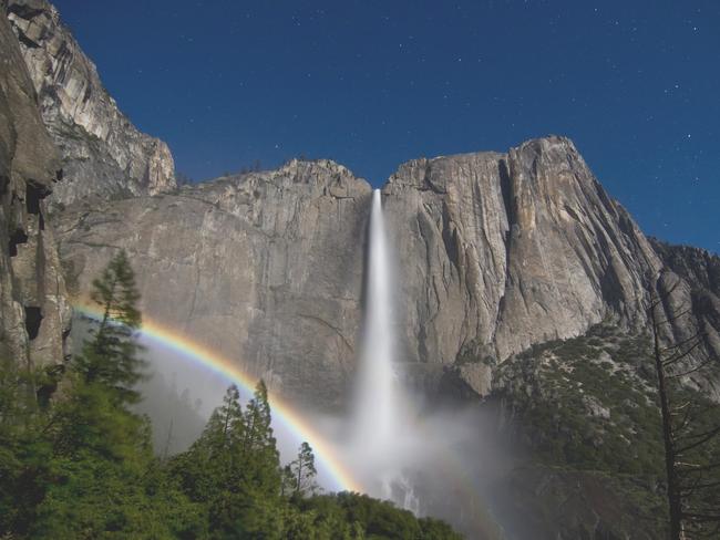 Moonbow at night at Yosemite Falls, Yosemite National Park, Mariposa County, California.