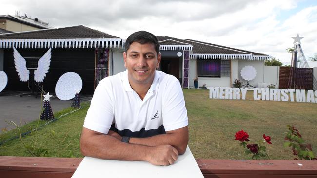 Christmas lights competition winner Reeju James at his Pacific Pines home. Picture Glenn Hampson