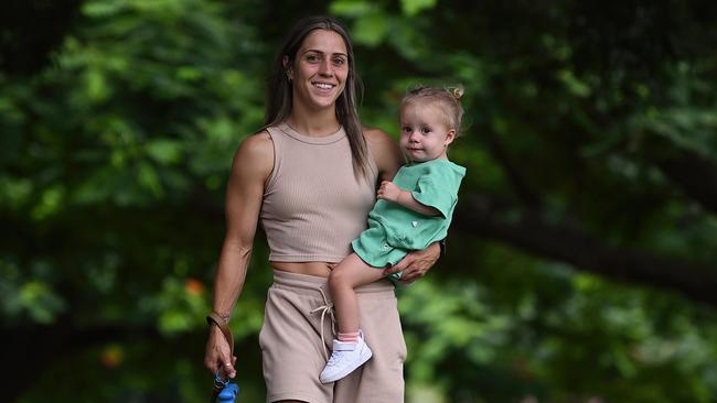 10/03/2023 : Australian women's soccer player Katrina Gorry and her daughter Harper (and their dog Rio), in New Farm Park, Brisbane.   pic Lyndon Mechielsen/Courier Mail