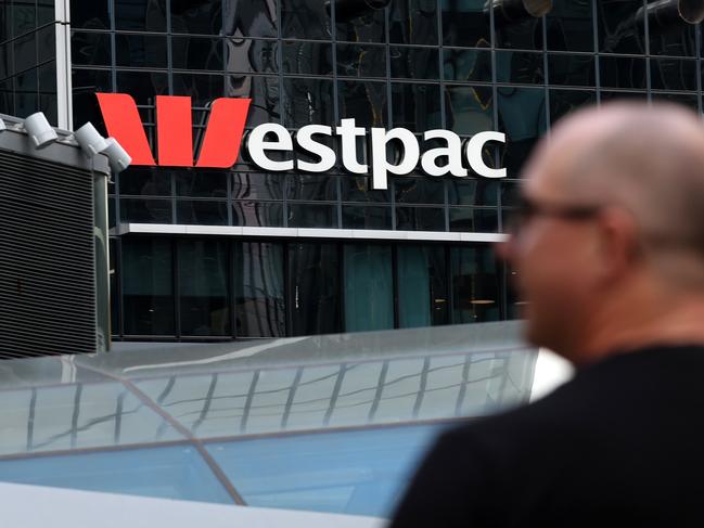 SYDNEY, AUSTRALIA - MARCH 27: A pedestrian walks past Westpac Banking Corp. logo at Westpac Place building on March 27, 2024 in Sydney, Australia. In the last quarter, Westpac Bank reported a quarterly cash profit of A$1.8 billion, meeting consensus expectations, while NAB experienced a 17% decline in first-quarter cash profit compared to the previous corresponding period, reflecting varying performances among the major Australian banks. (Photo by Brendon Thorne/Getty Images) (Photo by Brendon Thorne/Getty Images)