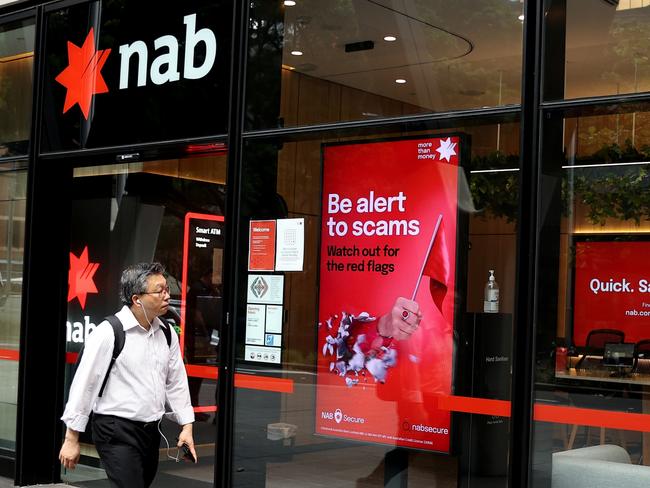 SYDNEY, AUSTRALIA - MARCH 27: Pedestrians walk past National Australia Bank Ltd. branch at Barangaroo on March 27, 2024 in Sydney, Australia. In the last quarter, Westpac Bank reported a quarterly cash profit of A$1.8 billion, meeting consensus expectations, while NAB experienced a 17% decline in first-quarter cash profit compared to the previous corresponding period, reflecting varying performances among the major Australian banks. (Photo by Brendon Thorne/Getty Images) (Photo by Brendon Thorne/Getty Images)