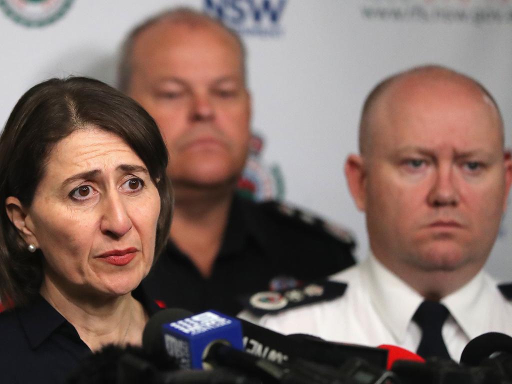 NSW Premier Gladys Berejiklian (left) speaks to the media during a press conference at the NSW Rural Fire Service (RFS) Headquarters in Sydney, Wednesday, January 1, 2020. Several bushfire-ravaged communities in NSW have greeted the new year under immediate threat. (AAP Image/Jeremy Ng) NO ARCHIVING