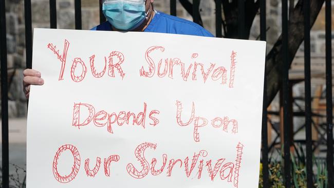 A nurse in New York hold a pertinent sign. Picture: AP