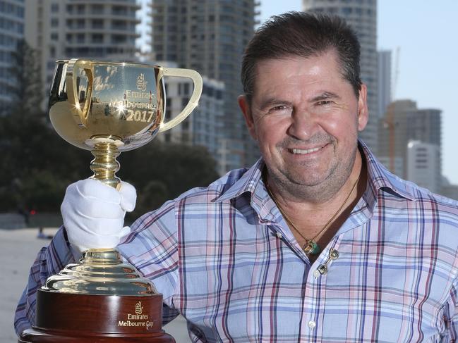 The Melbourne Cup is in town and former Melbourne Cup jockey Wayne Harris is taking it around the country to give people a look at what all the fuss is about first Tuesday in November. Wayne and the cup visit Surfers Paradise beach. Picture Glenn Hampson