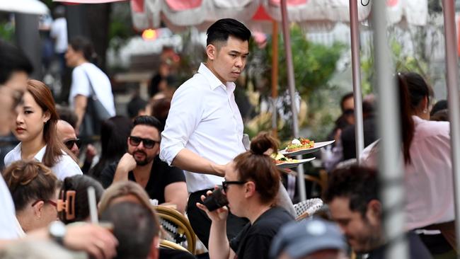 SYDNEY, AUSTRALIA - NewsWire Photos OCTOBER 22, 2022: Casual staff work the tables at a cafe in the Rocks in Sydney.Picture: NCA NewsWire / Jeremy Piper