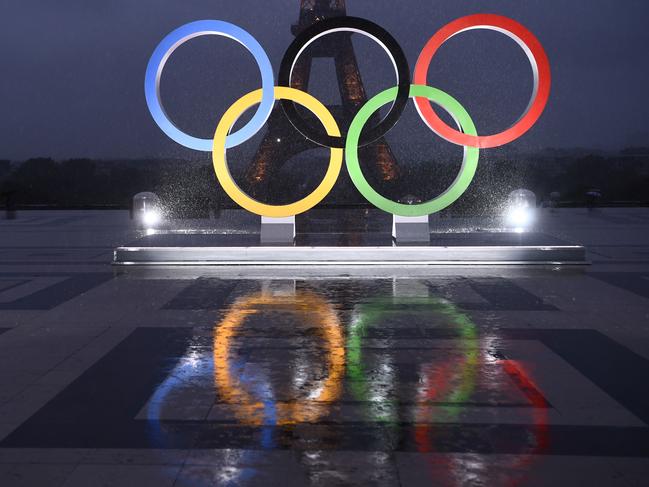 A picture shows the Olympics Rings on the Trocadero  Esplanade near the Eiffel Tower in Paris, on September 13, 2017, after the  International Olympic Committee named Paris host city of the 2024 Summer Olympic Games. The International Olympic Committee named Paris and Los Angeles as hosts for the 2024 and 2028 Olympics on September 13, 2017, crowning two cities at the same time in a historic first for the embattled sports body. / AFP PHOTO / CHRISTOPHE SIMON