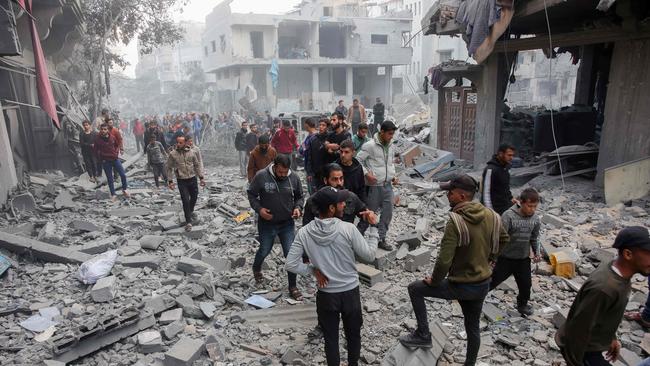 Gaza City residents at the site of an Israeli strike on December 3, 2024, as Palestinian factions continue to search for a peace deal. Picture: AFP