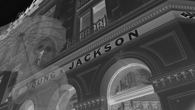 A girl with a parasol is believed to haunt the street outside Young and Jackson. Digital image.