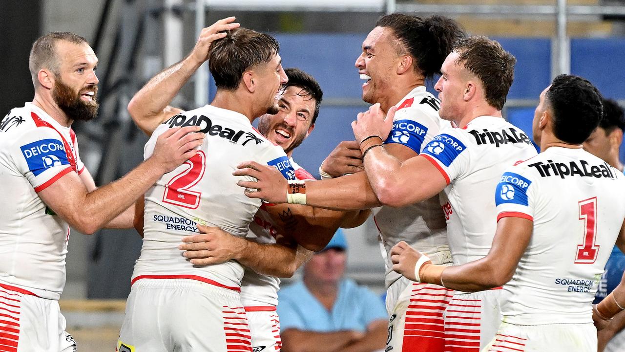 GOLD COAST, AUSTRALIA - MARCH 09: Zac Lomax of the Dragons is congratulated by teammates after scoring a try during the round one NRL match between the Gold Coast Titans and St George Illawarra Dragons at Cbus Super Stadium, on March 09, 2024, in Gold Coast, Australia. (Photo by Bradley Kanaris/Getty Images)