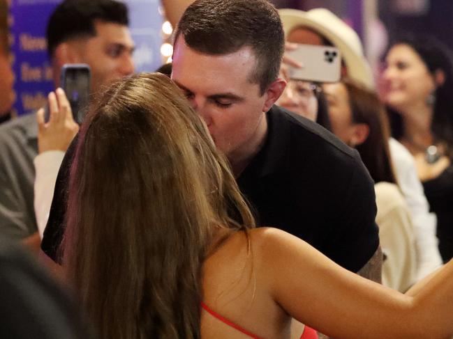 People kissing in the street during the start of the new year, New Year's Eve 2020, Fortitude Valley, Brisbane. Photographer: Liam Kidston.