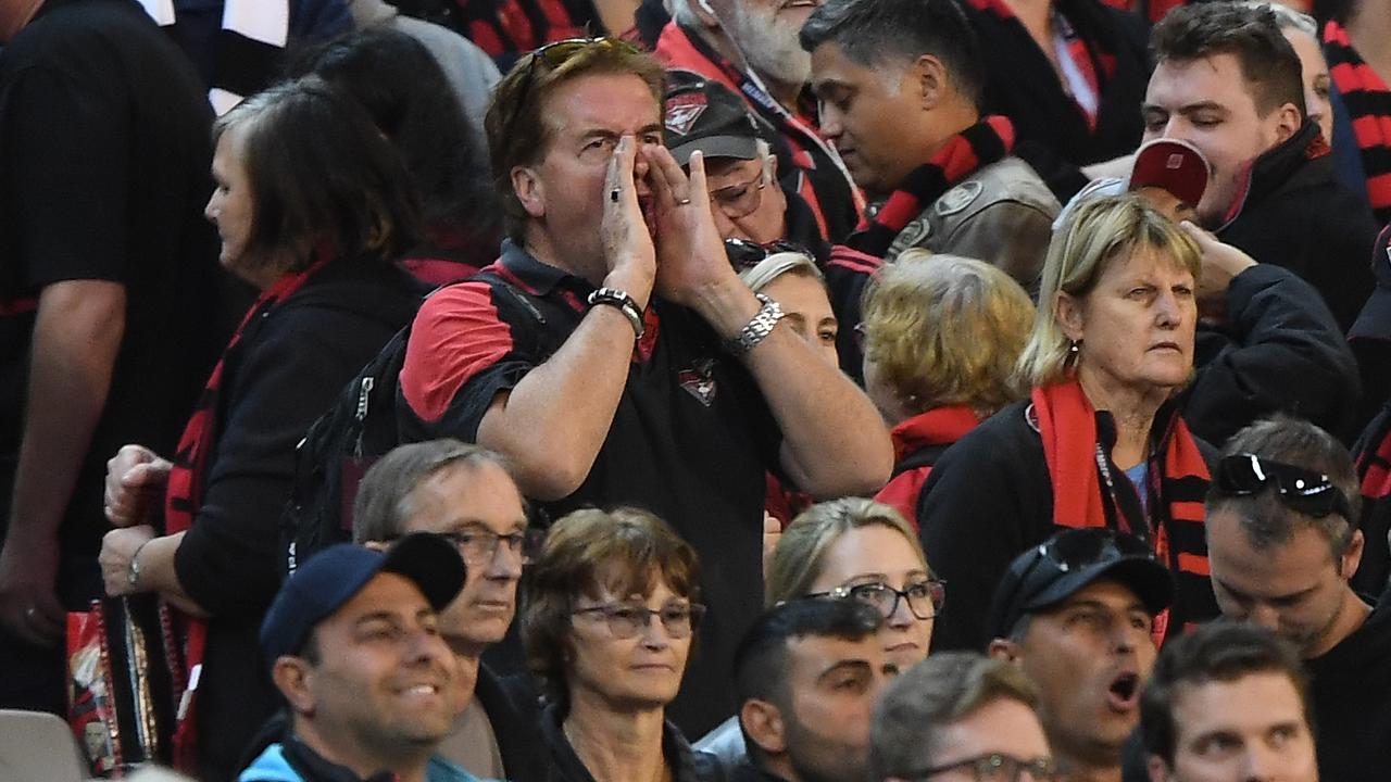 A health expert has suggested the AFL could tell fans to limit booing and shouting if they’re permitted to enter late-season matches. (AAP Image/Julian Smith)