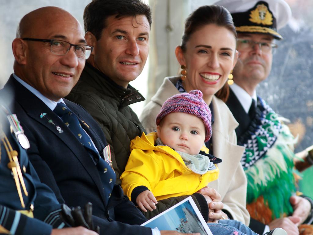 New Zealand’s Prime Minister Jacinda Ardern, her partner Clarke Gayford and their daughter Neve with the Royal New Zealand Navy in Auckland. Picture: Phil Walter/Getty Images