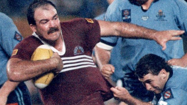 How to be a strong man … Martin Bella (being tackled by David Gillespie back in 1991) influenced one of the characters in Brendan Cowell’s novel Plum.