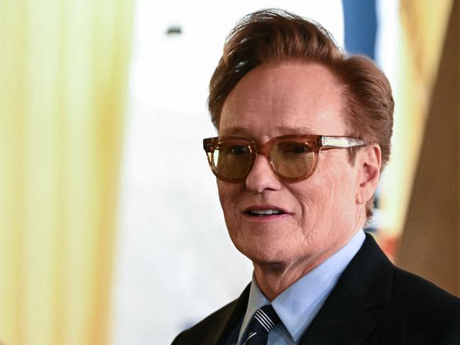 US comedian and this year's Oscars host Conan O'Brien participates in the rolling out of the red carpet for the Oscars arrivals area. Picture: AFP