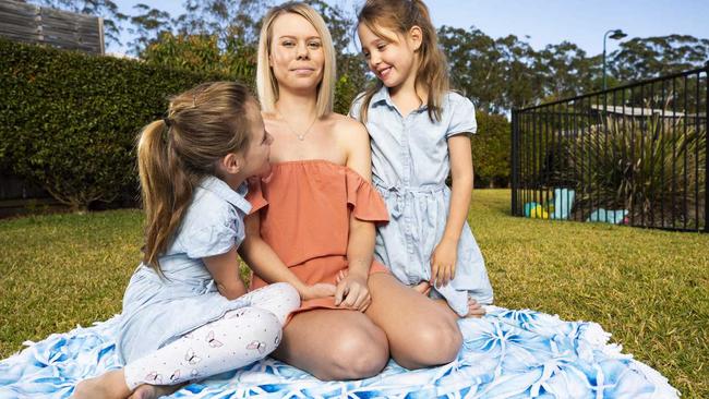 Beerwah mum Kasey-Rae Chambers with 6 year old twins Hallie and Harlow, who has dropped back from full-time to part-time work to avoid the rise in childcare costs. Photo Lachie Millard. Picture: Lachie Millard