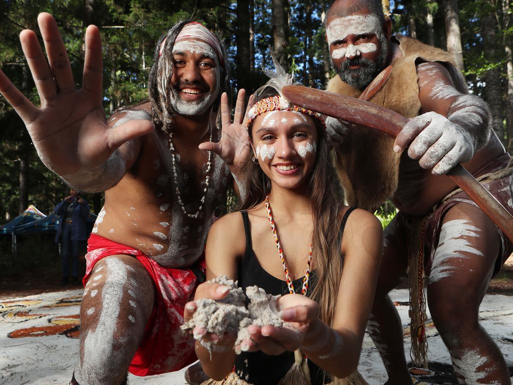 Butchulla dancers Bruce Waia, Destiny Sexton, and Conway Burns, celebrate the renaming of Fraser Island back to its original name of K’gari. Picture: Liam Kidston.