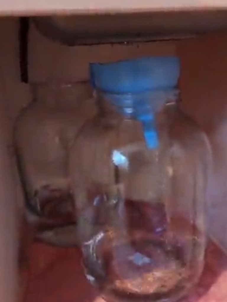 A tube goes into 4-litre jar and the water drains into another 4-litre jar so it doesn’t overflow. Picture: Supplied