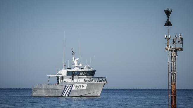 Police divers recover the body of the missing Nitisha Negi, 15, from the south side of the Glenelg marina breakwater. Picture: AAP/Mike Burton