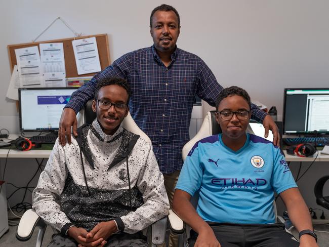 Alpha Omega Senior College Year 12 student Keenaan Jama has been learning at home by having sessions with his teacher and says “it’s going well”. He is pictured with his father Adam Jama and Year 10 brother Kaysar Jama. Picture: Supplied