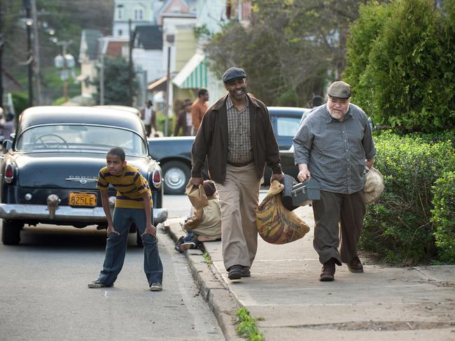 Denzel Washington plays Troy Maxson, Joven Adepo (son Cory) and Stephen McKinley Henderson as Jim Bono in a scene from Fences. Picture: David Lee / Paramount Pictures