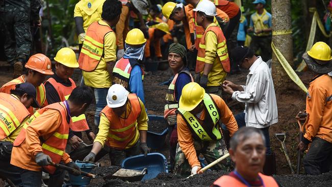 Digging the boys out is one option. Picture: AFP PHOTO / Lillian Suwanrumpha