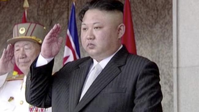 North Korea's leader Kim Jong-un salutes during a parade on Saturday. Picture: KRT via AP