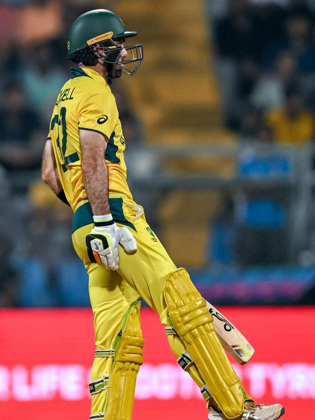 Australia's Glenn Maxwell gestures after a muscle cramp. (Photo by INDRANIL MUKHERJEE / AFP)