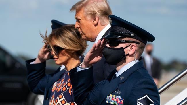 Donald Trump and Melania Trump exit Air Force One as they arrive at Palm Beach International Airport in West Palm Beach, Florida. Picture: AFP