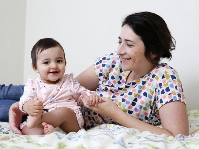 Sydney mother Tracey Wills with her daughter Ella, 9 months, has to go to different stores to find stock. Picture: Justin Lloyd.