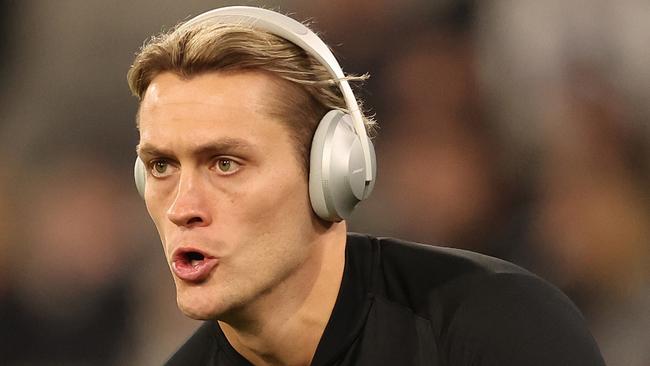 MELBOURNE, AUSTRALIA - JULY 12: Darcy Moore of the Magpies warms up prior to the round 18 AFL match between Collingwood Magpies and Geelong Cats at Melbourne Cricket Ground, on July 12, 2024, in Melbourne, Australia. (Photo by Robert Cianflone/Getty Images)