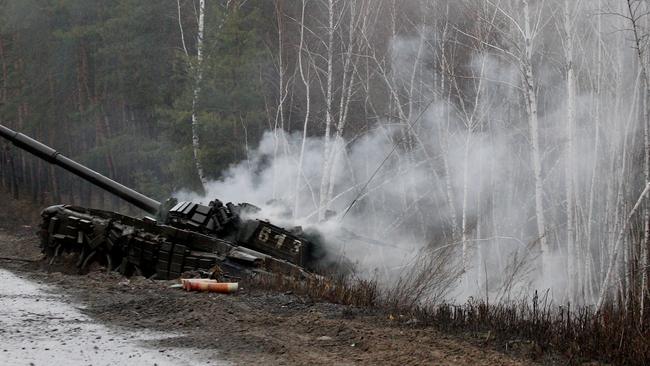 Smoke rises from a Russian tank destroyed by the Ukrainian forces. Picture: AFP