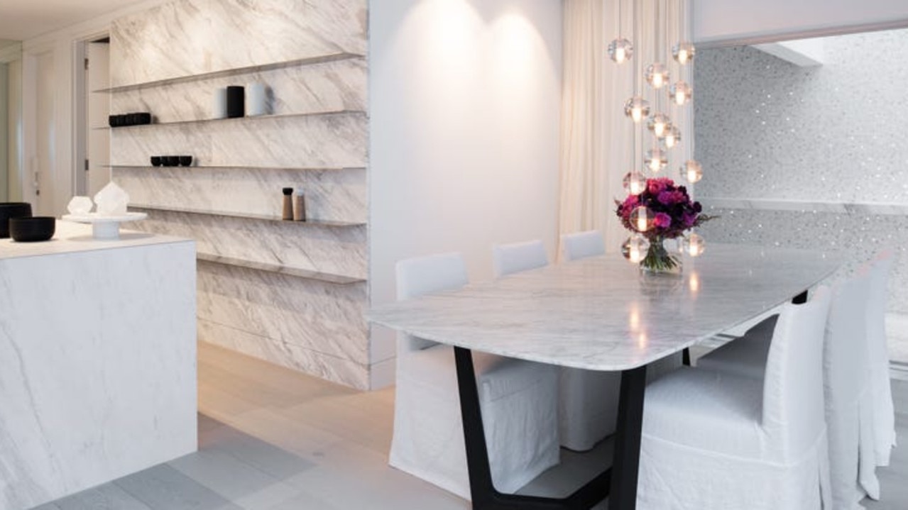 Sophisticated white marble surfaces in the kitchen.