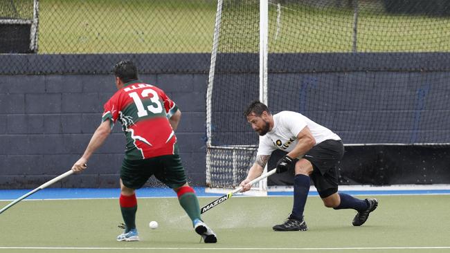 Kim Beris of Queensland Police and Emergency services side passed the ball against Redcliffe Red Schwarz team during the Brett Forte memorial hockey match played at the Mary Nairn Fields, Redcliffe, Saturday, October 6, 2018. Picture: AAP /Regi Varghese