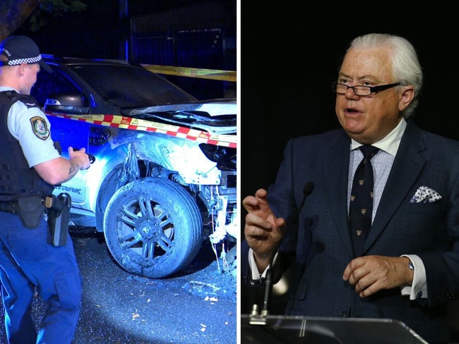 A policeman inspects a torched car early on Thursday. Picture Onscene Bondi. Federal Court judge Michael Lee. Picture: Britta Campion