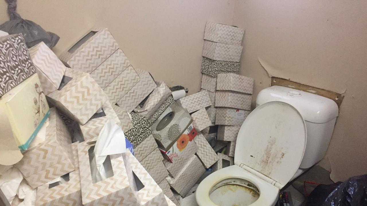 Toilet in the trashed unit at Runaway Bay.