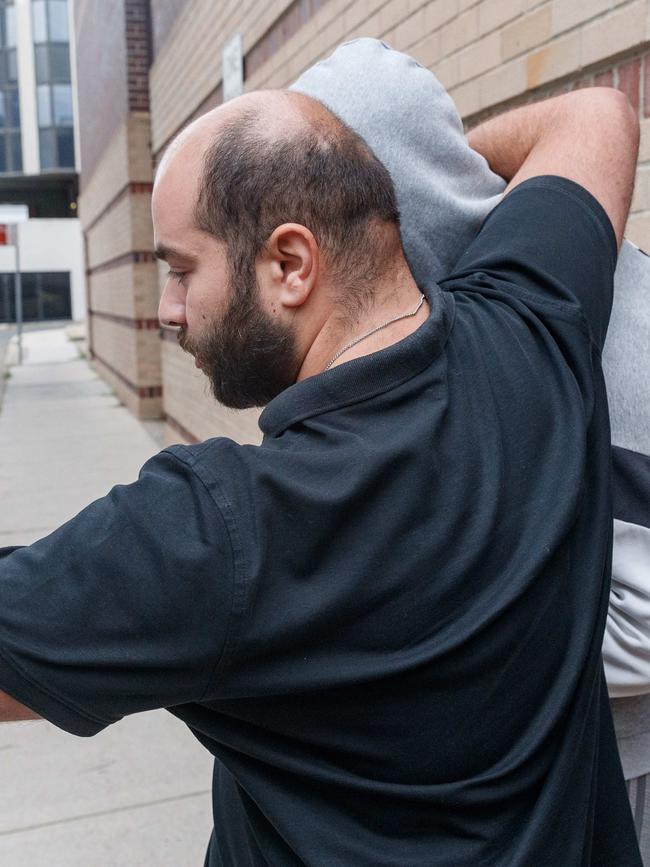 A supporter helped Mouait leave court.