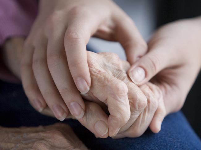 Aged persons hands held by young hands. Pic is Istock image. One time use only.