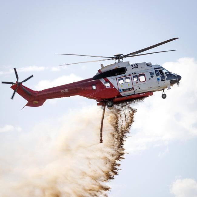 A water bomber mops up a spot fire near Beaufort last week. Picture: Mark Stewart