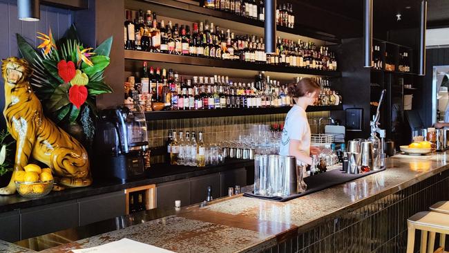 Bar Soma has quirky design details like a Tiger statue behind the bar. Photo: Contributed.