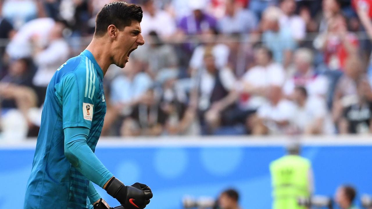 Belgium's goalkeeper Thibaut Courtois celebrates after Eden Hazard scores against England.