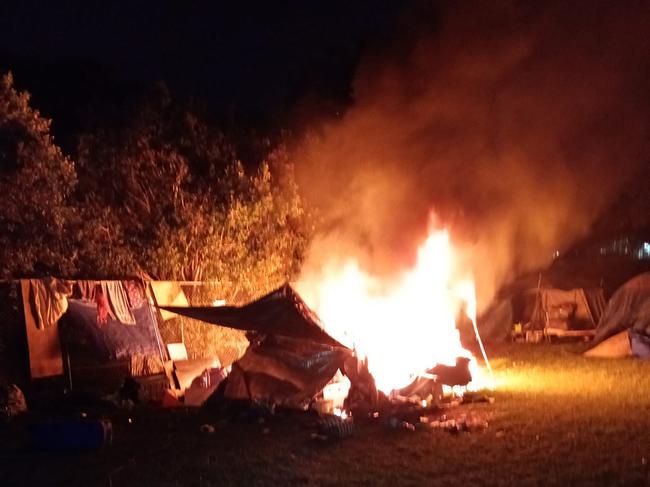 A tent on fire at Musgrave Park. Photo: Supplied