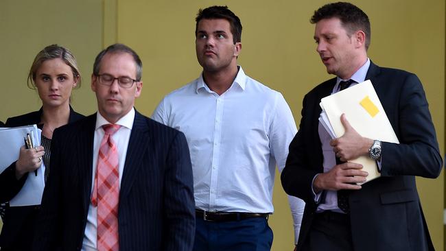 Gable Tostee (2nd right) and his lawyers Nick Dore (right) and Barrister Saul Holt QC (front left) at the Supreme Court in Brisbane, AAP Image/Dan Peled.