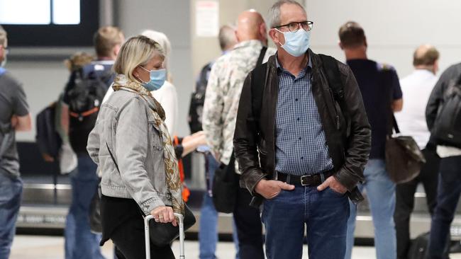 People arriving at Brisbane Airport from Sydney before lockdown. Picture: Liam Kidston.
