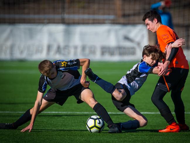 Rouse Hill Rams players Kai Wilson (left) and Aiden Kelly contest for the ball during their clash with Kemps Creek in the Football NSW under-14 State Cup Finals. Picture: Photosbyloopii/George Loupis