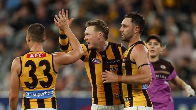 MELBOURNE, AUSTRALIA - MARCH 20: James Sicily of the Hawks (C) celebrates kicking a goal during the round two AFL match between Carlton Blues and Hawthorn Hawks at Melbourne Cricket Ground on March 20, 2025, in Melbourne, Australia. (Photo by Robert Cianflone/Getty Images)