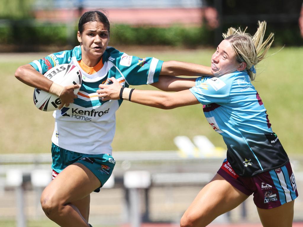 Jordana Woods fends off Cutters' Jaccoa Keyssecker in the Queensland Rugby League (QRL) Under 19 Women's match between the Northern Pride and the Mackay Cutters, held at Barlow Park. Picture: Brendan Radke