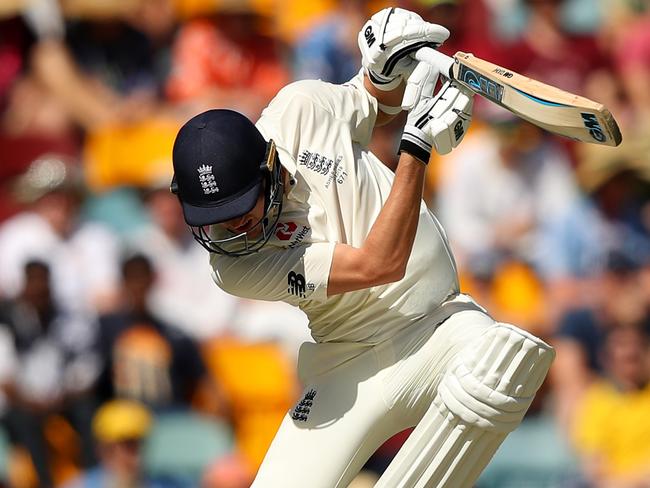 England’s Jake Ball avoids a Pat Cummins lifter in the first Test in Brisbane.